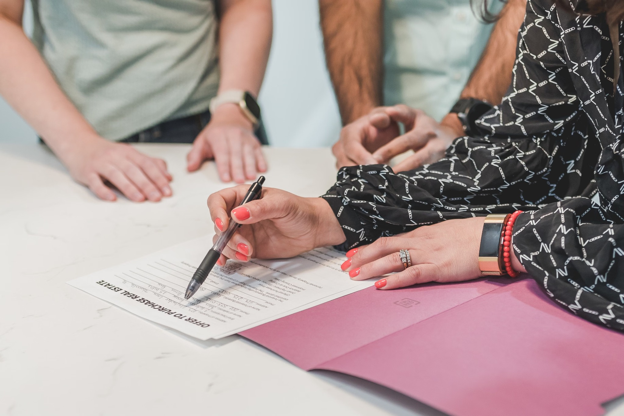 People reviewing closing paperwork